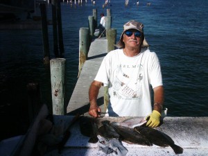 Bob Burgess with a table full of flounder